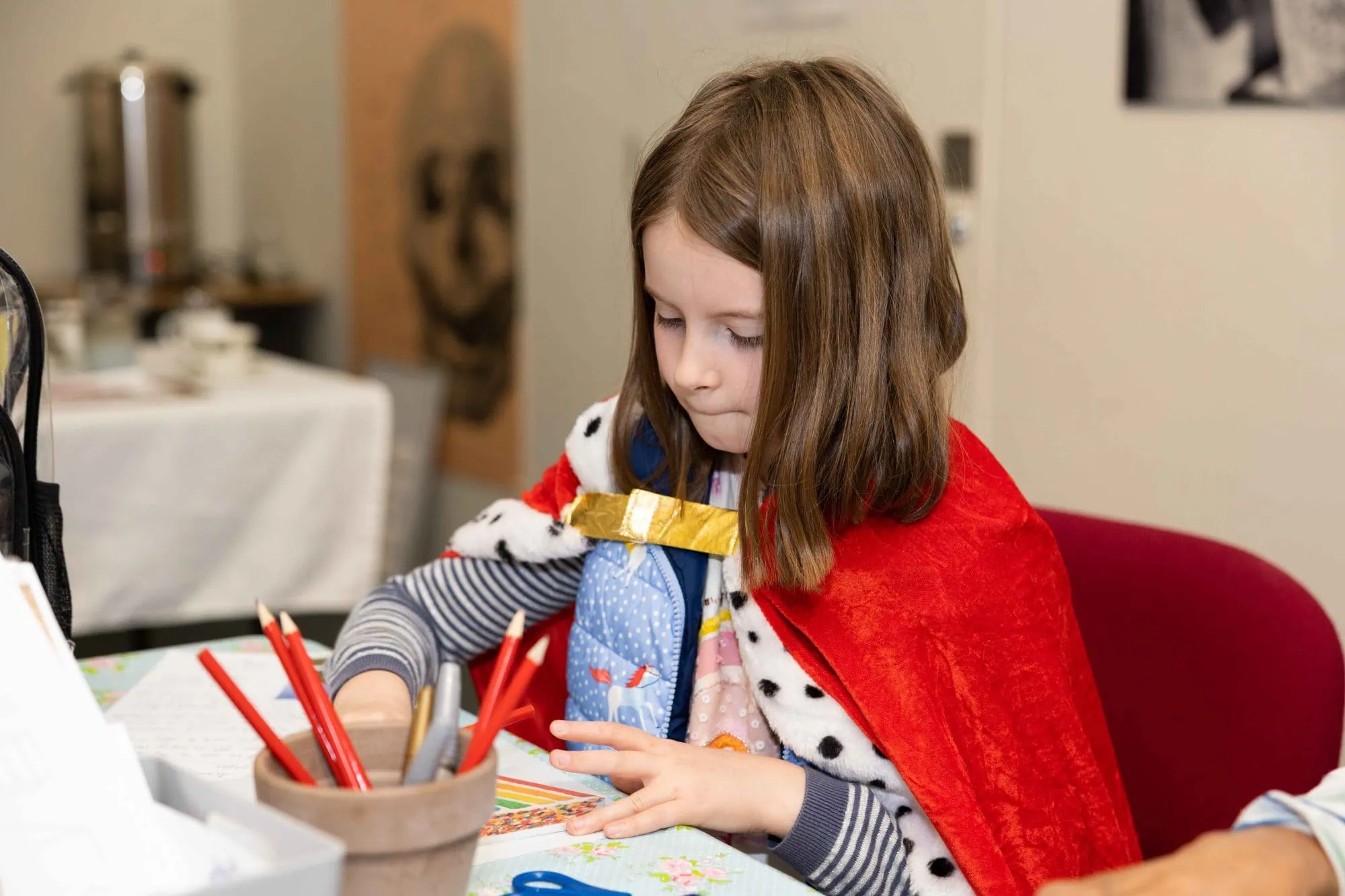 Child painting pottery