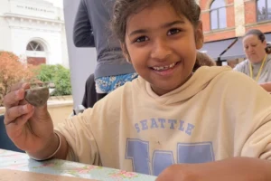 child making pottery