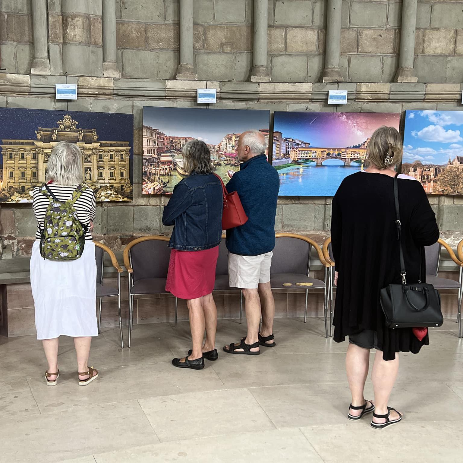 people viewing art in cathedral